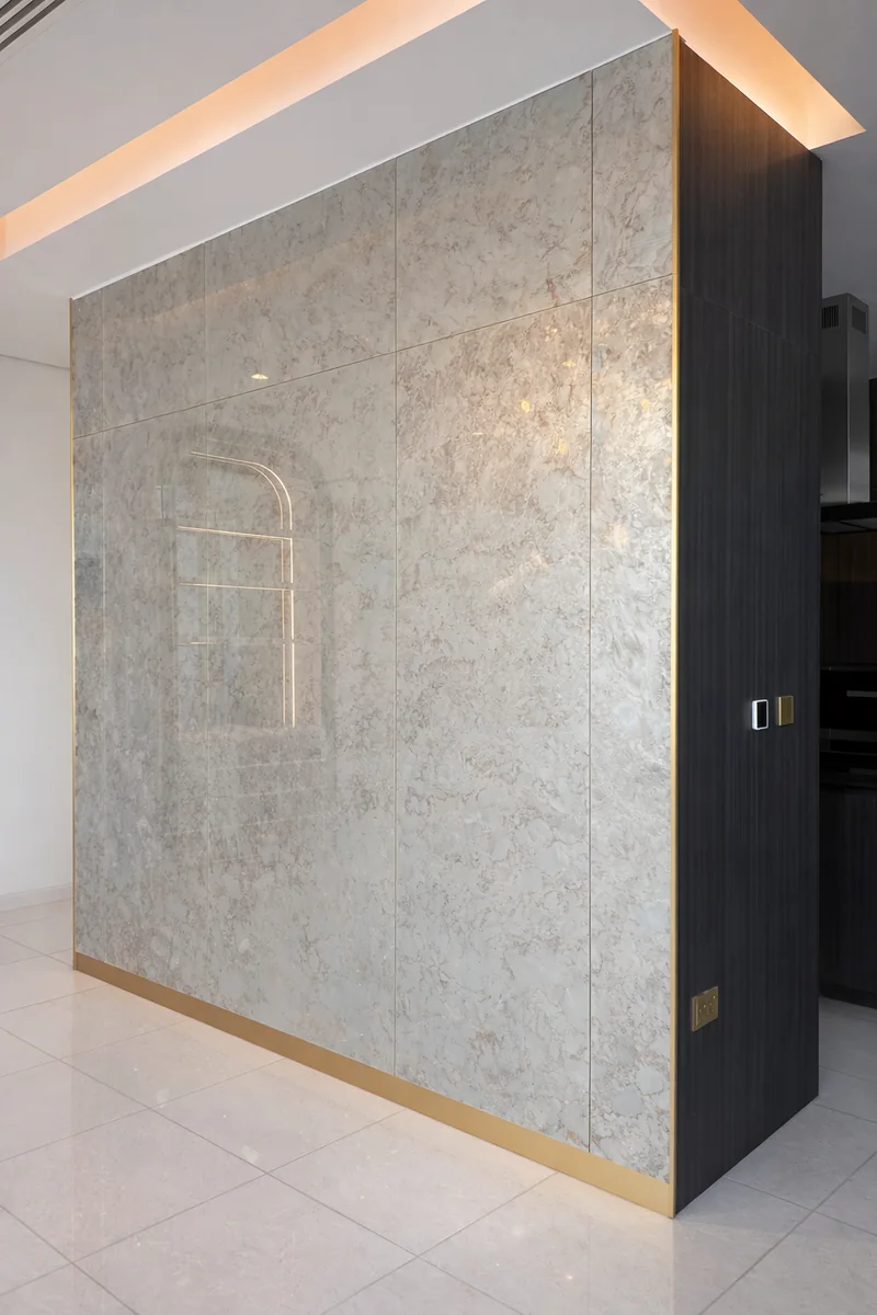 Bespoke built-in wardrobe with ambient lighting – Noora Tower Dubai master suite Creative Avenue