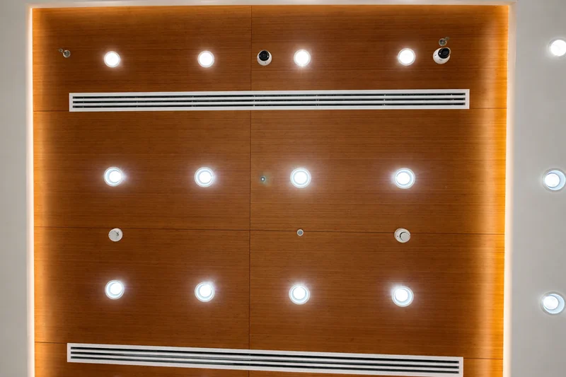 Symmetrical wood ceiling with downlights – Creative Avenue retail fit-out Sharjah UAE